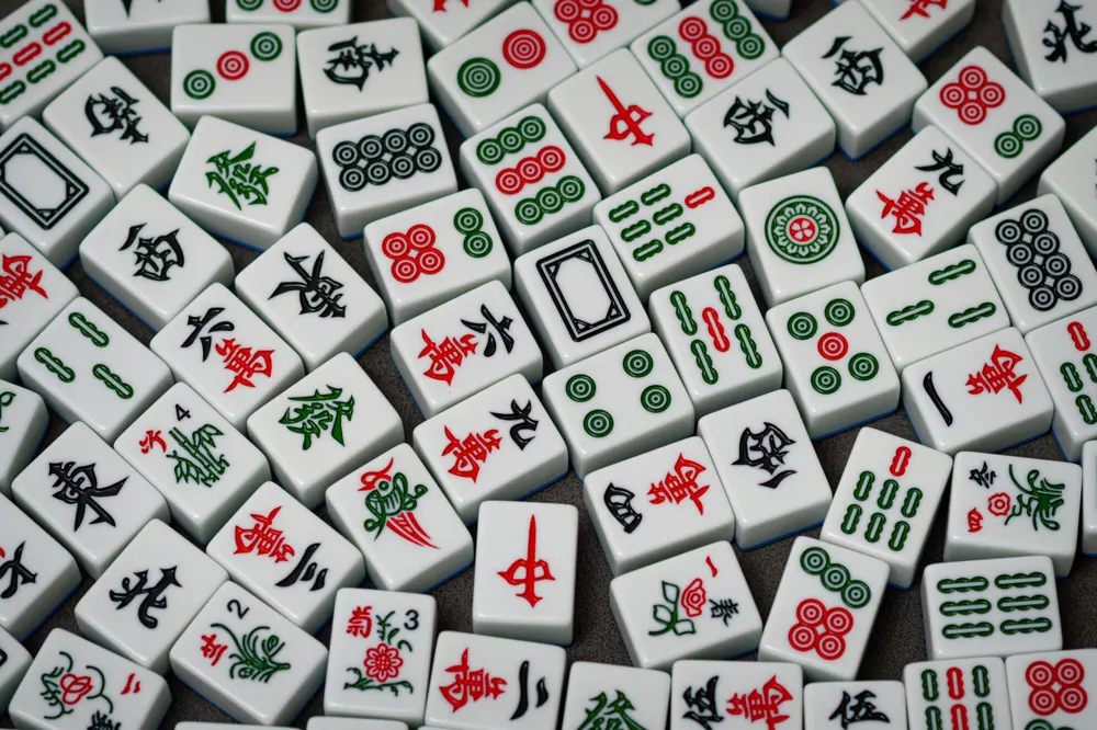 A spread of Mahjong tiles in red, green and blue